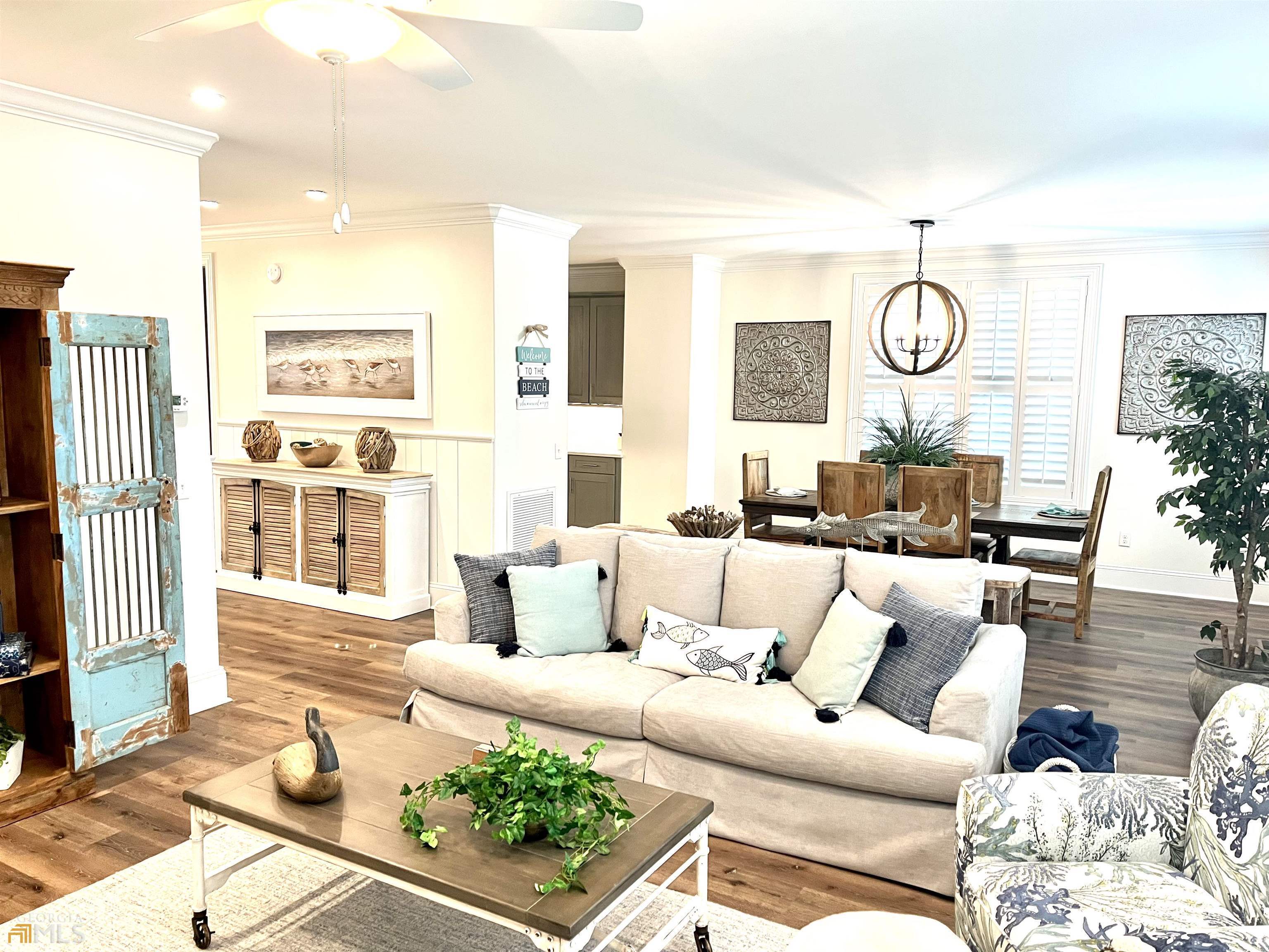 1548 Ocean Boulevard St. Simons, GA 31522 - Photo 9 of 64 a living room with furniture and a window