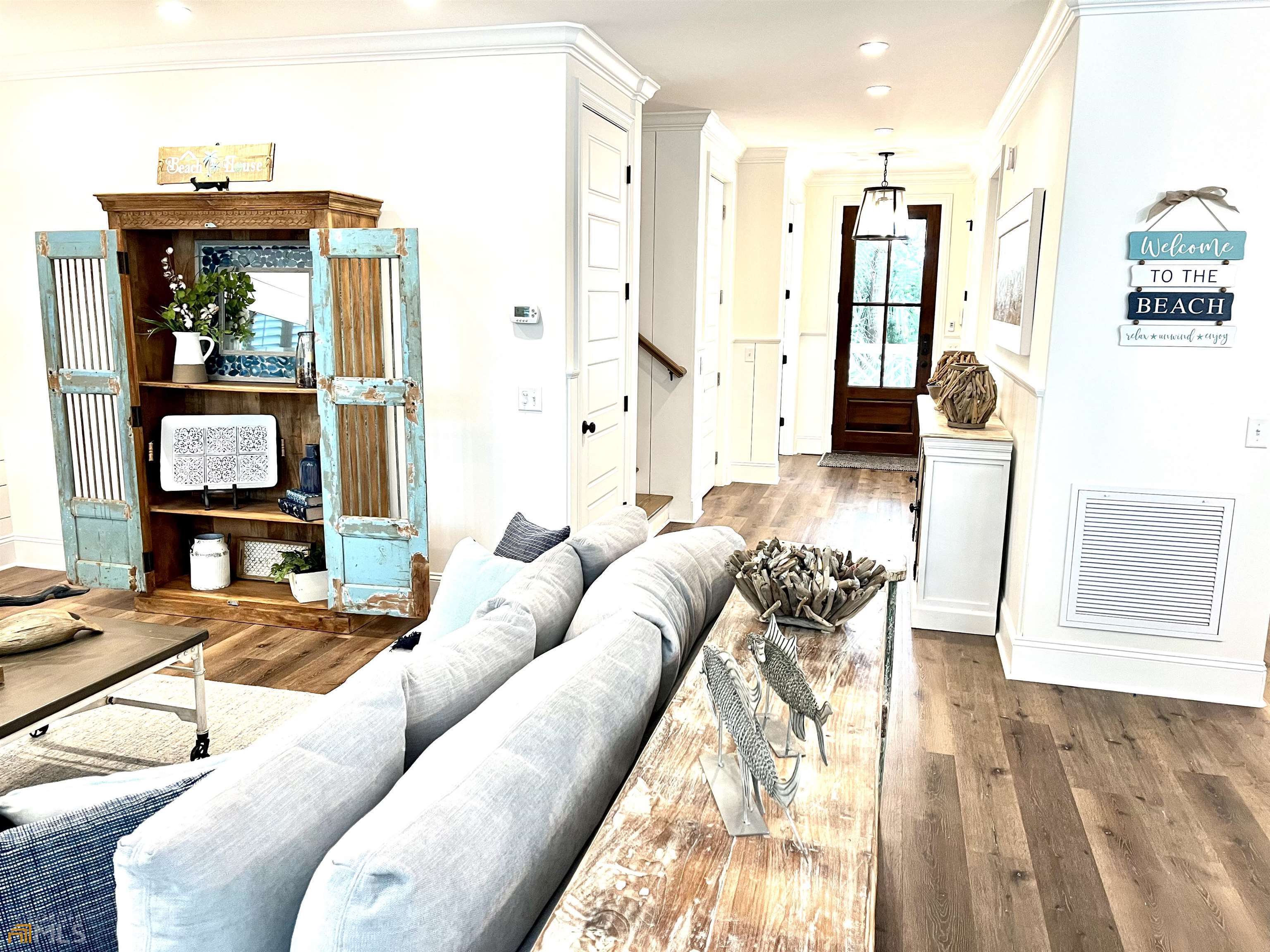 1548 Ocean Boulevard St. Simons, GA 31522 - Photo 10 of 64 a living room with furniture and a large window