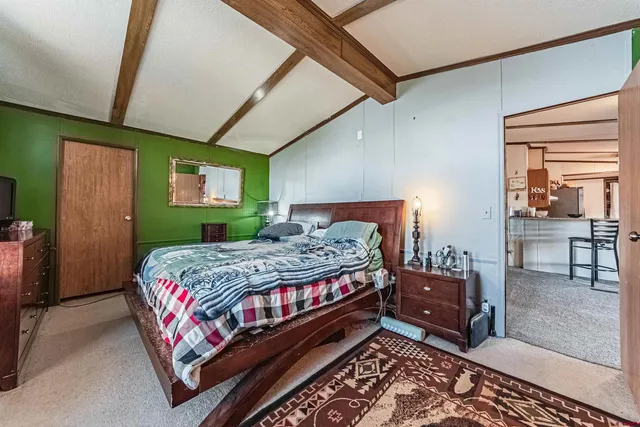 a bedroom with a bed and window