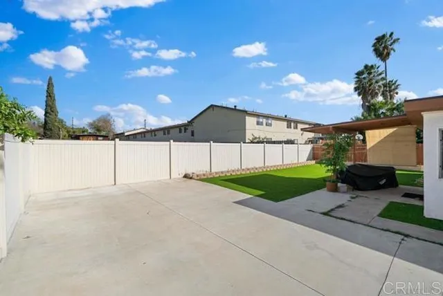 a view of a house with a yard and garage