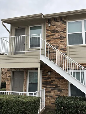 front view of a house with large windows