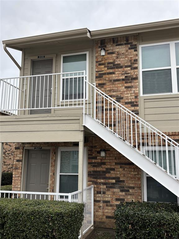 front view of a house with large windows
