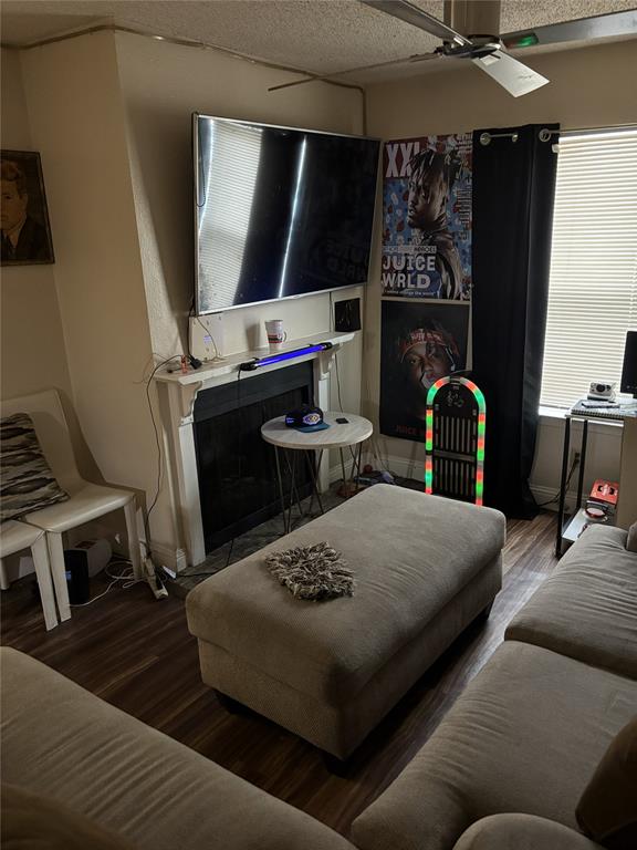 2200 East Trinity Mills Road, Unit 208 Carrollton, TX 75006 - Photo 11 of 23 a living room with furniture and a fireplace