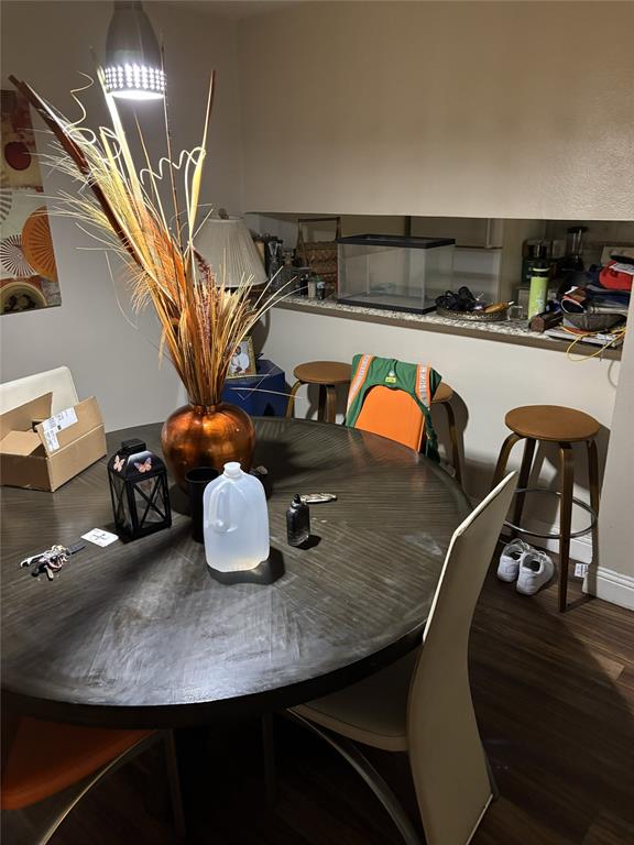 2200 East Trinity Mills Road, Unit 208 Carrollton, TX 75006 - Photo 12 of 23 a room with table and chairs