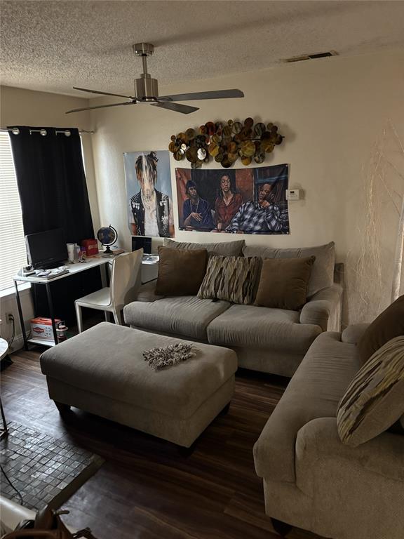 2200 East Trinity Mills Road, Unit 208 Carrollton, TX 75006 - Photo 13 of 23 a living room with furniture and a flat screen tv