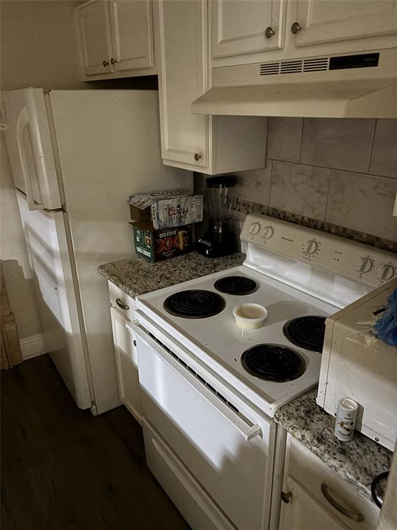 2200 East Trinity Mills Road, Unit 208 Carrollton, TX 75006 - Photo 14 of 23 a kitchen with a stove and a sink