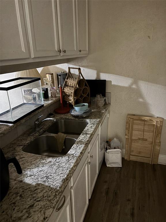 2200 East Trinity Mills Road, Unit 208 Carrollton, TX 75006 - Photo 15 of 23 a kitchen with a sink and cabinets