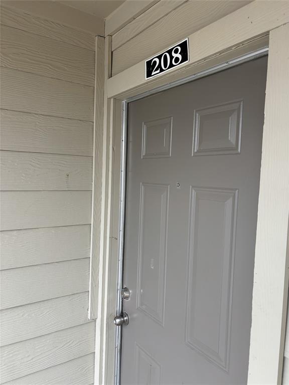 2200 East Trinity Mills Road, Unit 208 Carrollton, TX 75006 - Photo 2 of 23 a close view of door