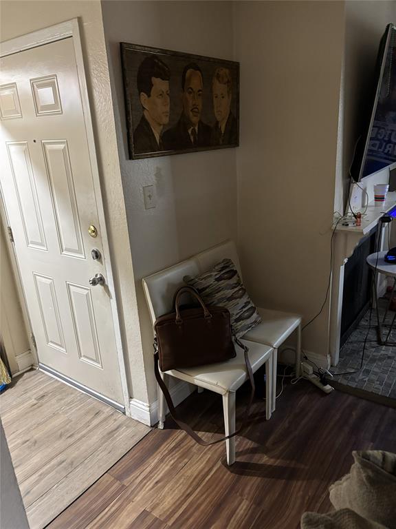 2200 East Trinity Mills Road, Unit 208 Carrollton, TX 75006 - Photo 10 of 23 a view of a hallway with wooden floor and furniture
