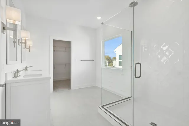 a bathroom with a shower and a sink