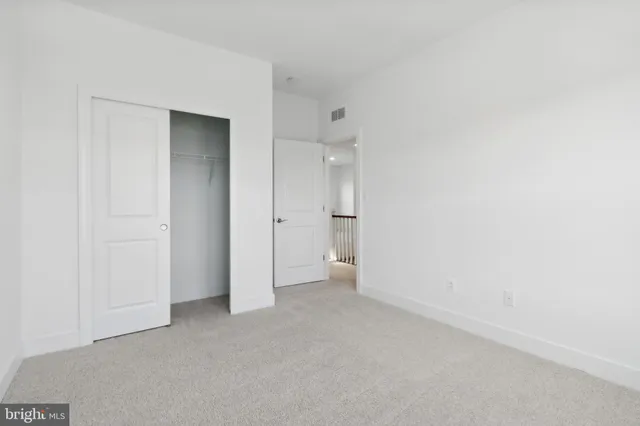 a view of an empty room and closet