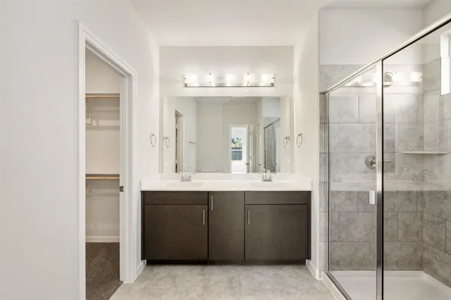 an empty room with a ceiling fan and a window