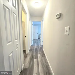 a bathroom with a toilet a sink and a mirror