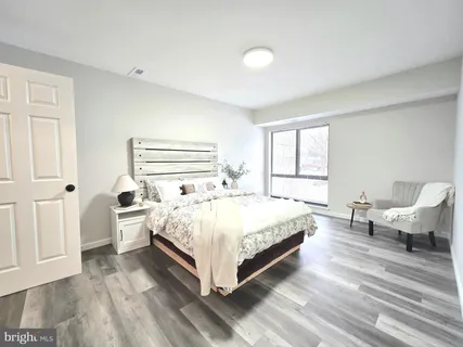 a bedroom with a bed and window