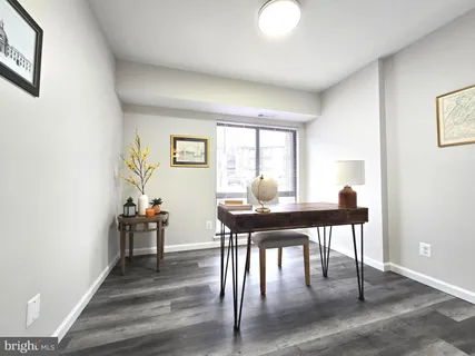 a workspace with furniture and wooden floor