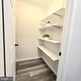 a view of a backyard with wooden fence