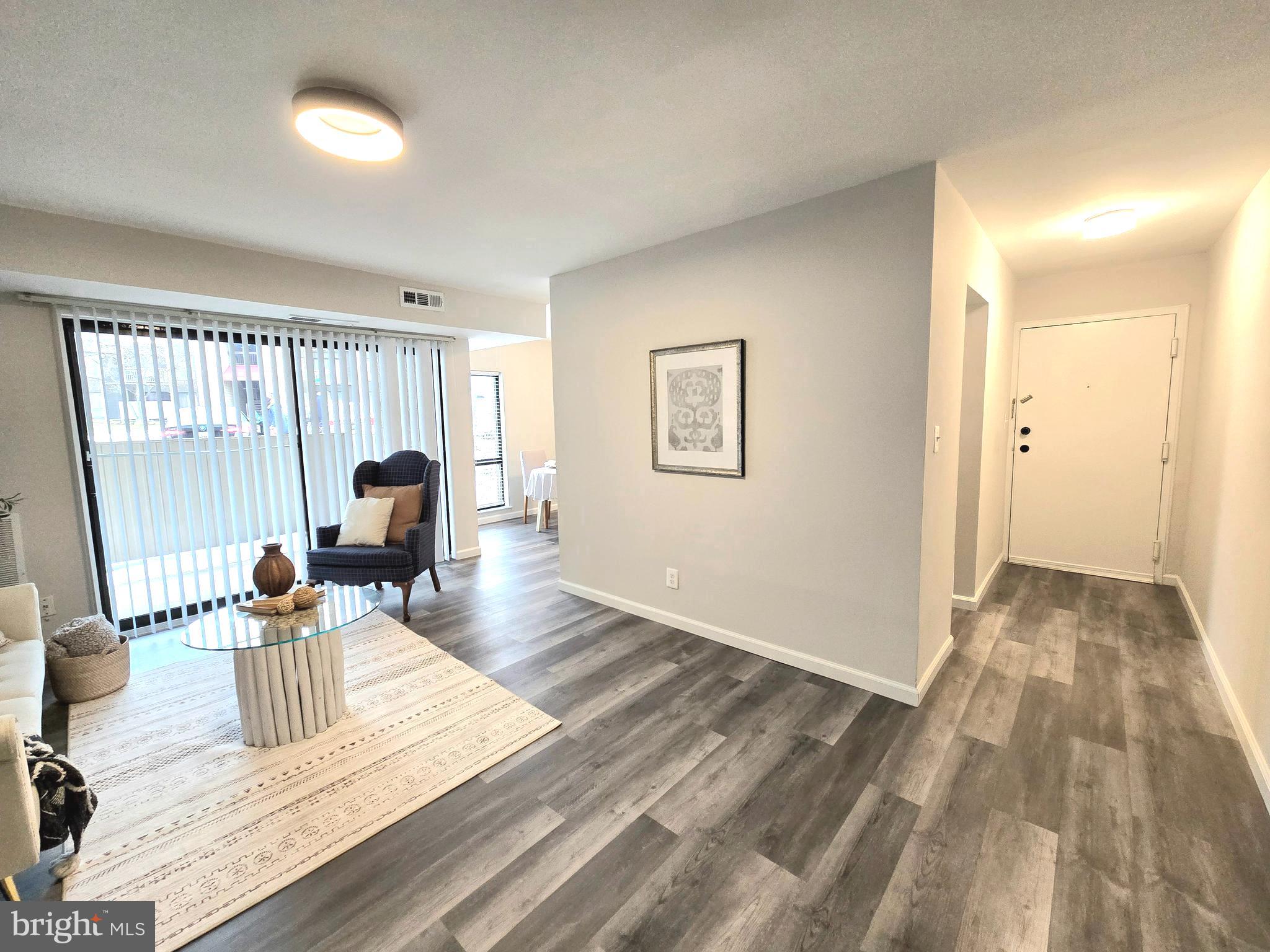 6089 Majors Lane, Unit 4 Columbia, MD 21045 - Photo 6 of 31 Luxury Vinyl Floors Throughout the Unit