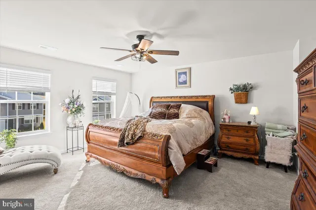 a bedroom with a bed a couch and a couch