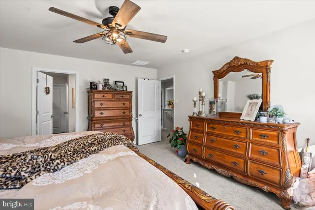 a bedroom with a bed and a dresser