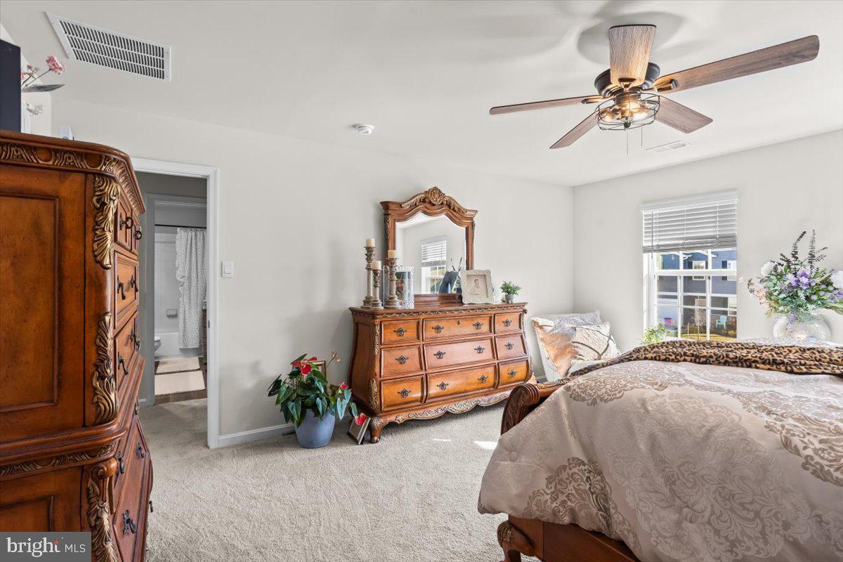 4310 Brent Dr Spring Grove Spring Grove, PA 17362 - Photo 21 of 36 a bedroom with a bed and a chandelier