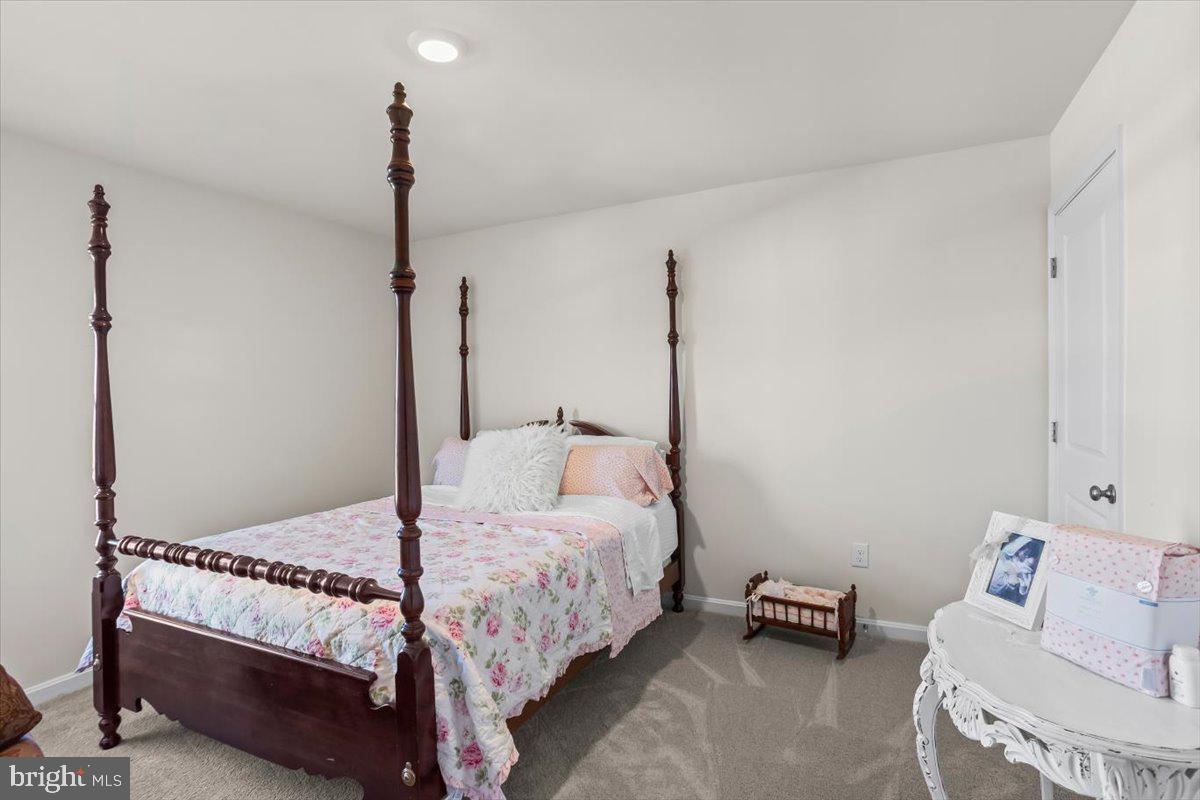 4310 Brent Dr Spring Grove Spring Grove, PA 17362 - Photo 25 of 36 a bedroom with a bed and a couch