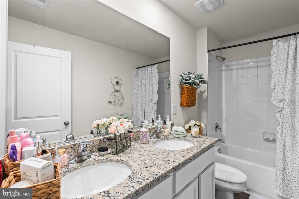 4310 Brent Dr Spring Grove Spring Grove, PA 17362 - Photo 27 of 36 a bathroom with a granite countertop sink and a mirror