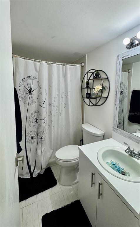 7111 Southwest 129th Avenue, Unit 1 Miami, FL 33183 - Photo 14 of 16 a bathroom with a sink toilet and shower