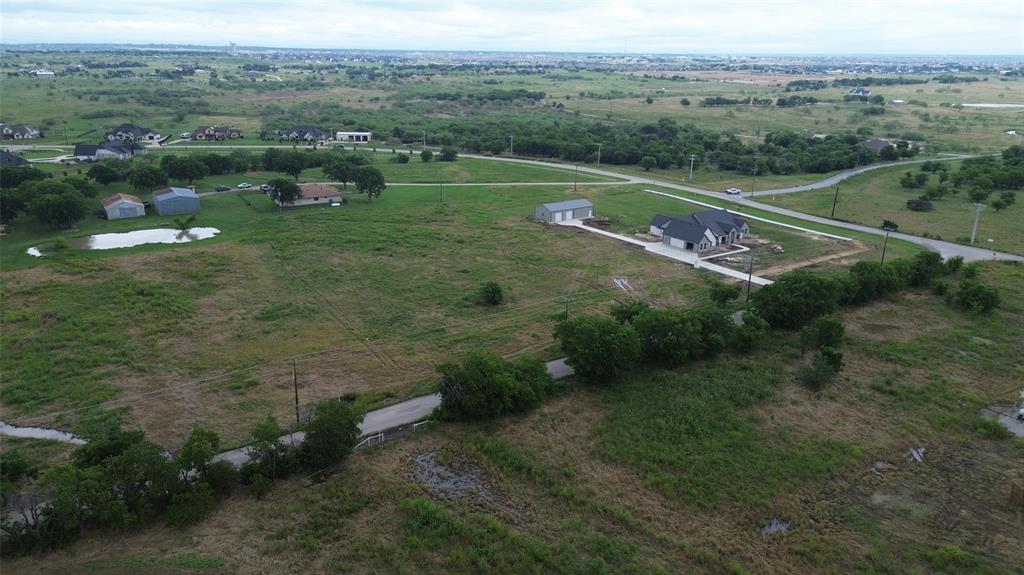 6555 Florance Road Northlake, TX 76247 - Photo 2 of 4 a view of a lake with huge green field with lots of trees