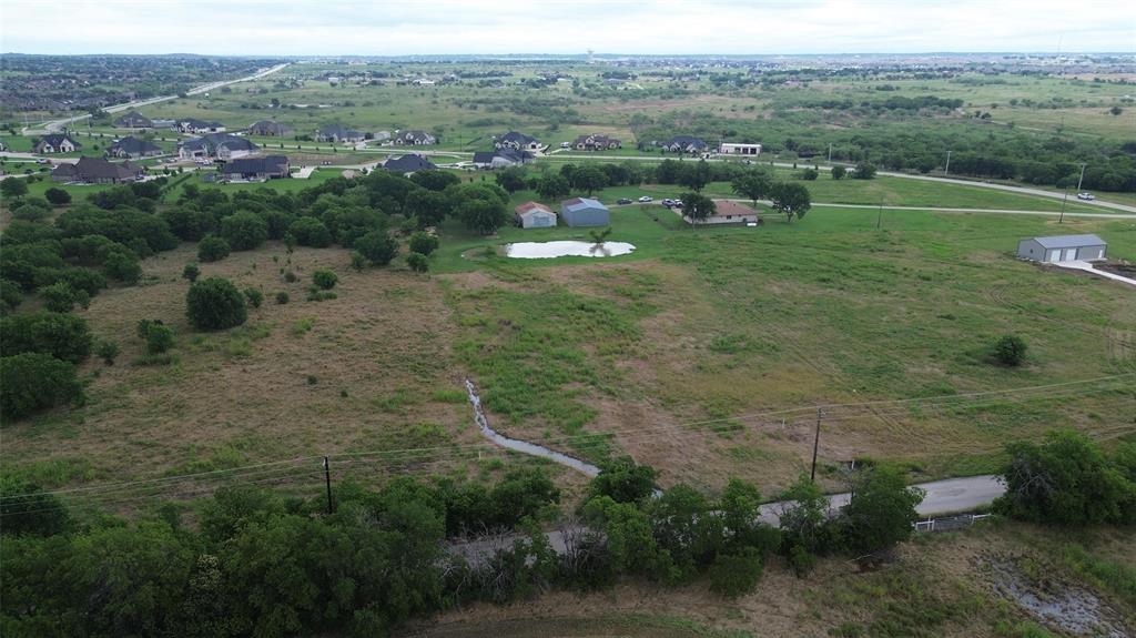 6555 Florance Road Northlake, TX 76247 - Photo 3 of 4 a view of a garden with a building in the background