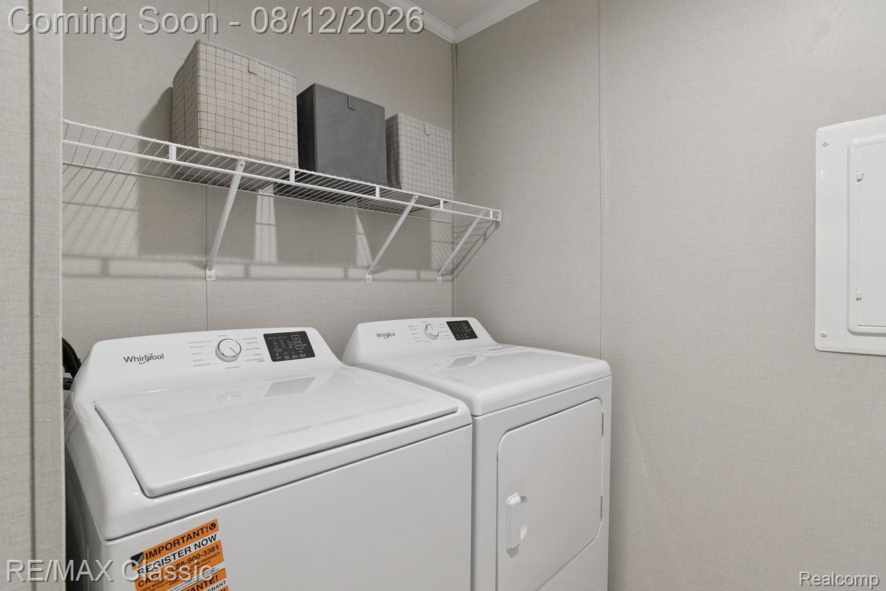 7105 West Vienna Road Clio, MI 48420 - Photo 21 of 23 Laundry area with wire shelving