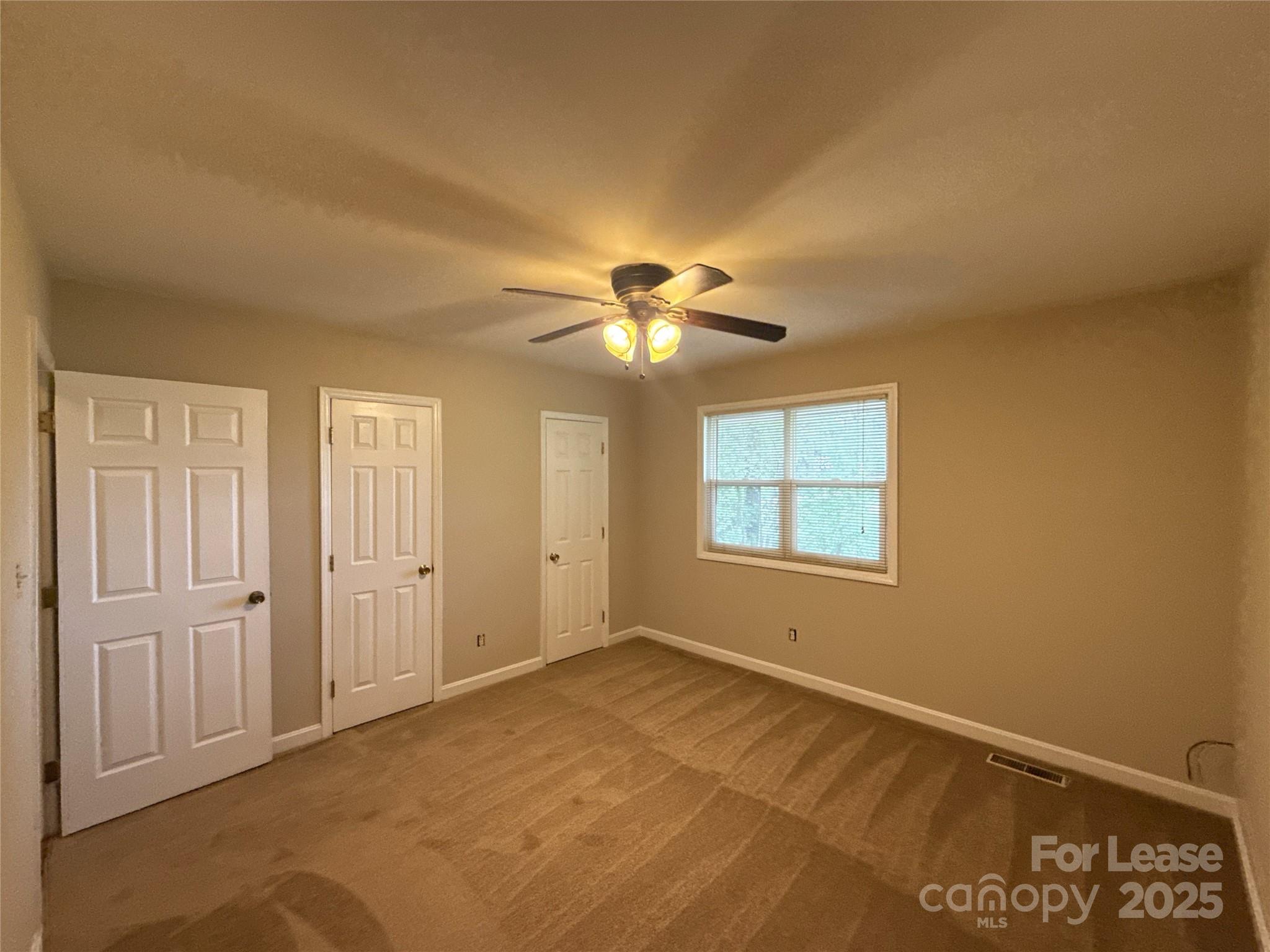 1613 North Sharon Amity Road, Unit A Charlotte, NC 28205 - Photo 8 of 11 a view of an empty room with a window