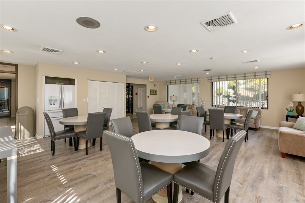 1008 Paradise Road, Unit 2E Swampscott, MA 01907 - Photo 20 of 22 a view of a dining area with furniture