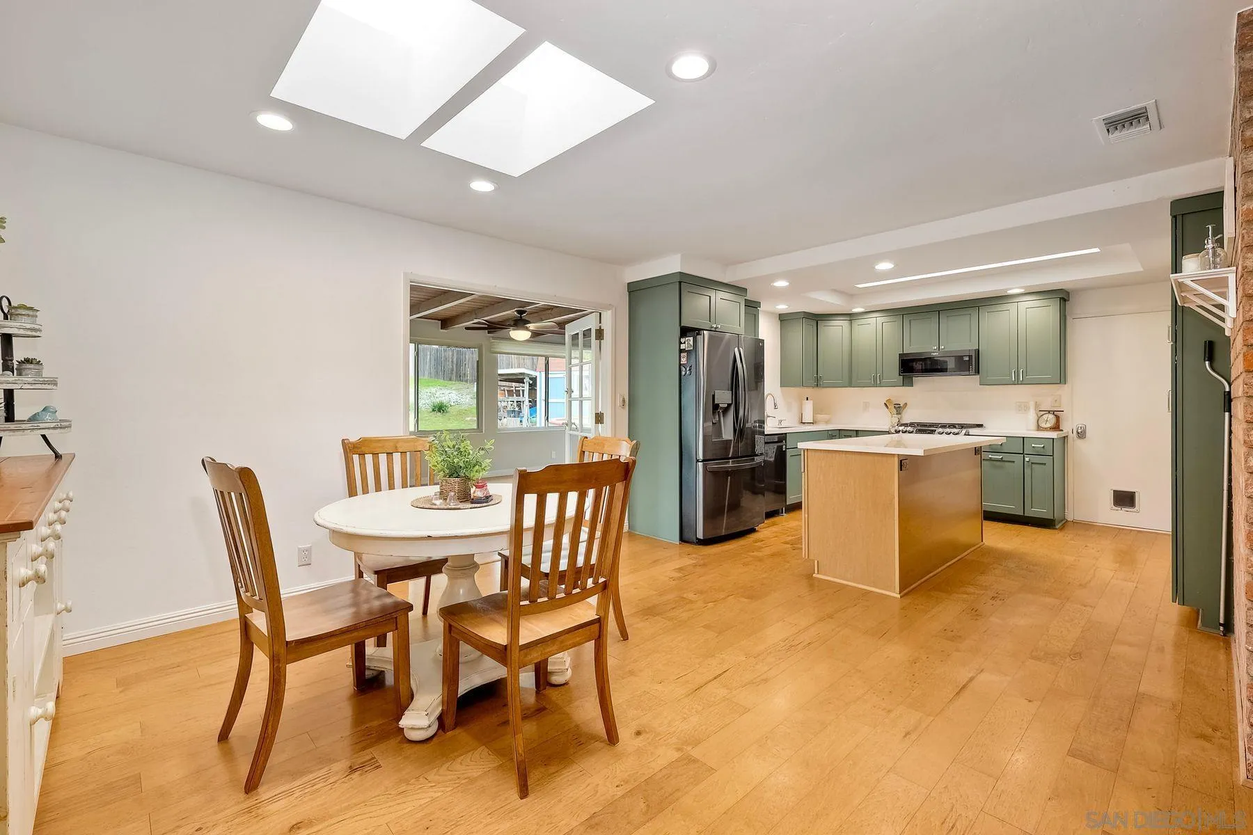 1915 Rockhoff Road Escondido, CA 92026 - Photo 11 of 43 a view of a dining room with furniture and a livingroom