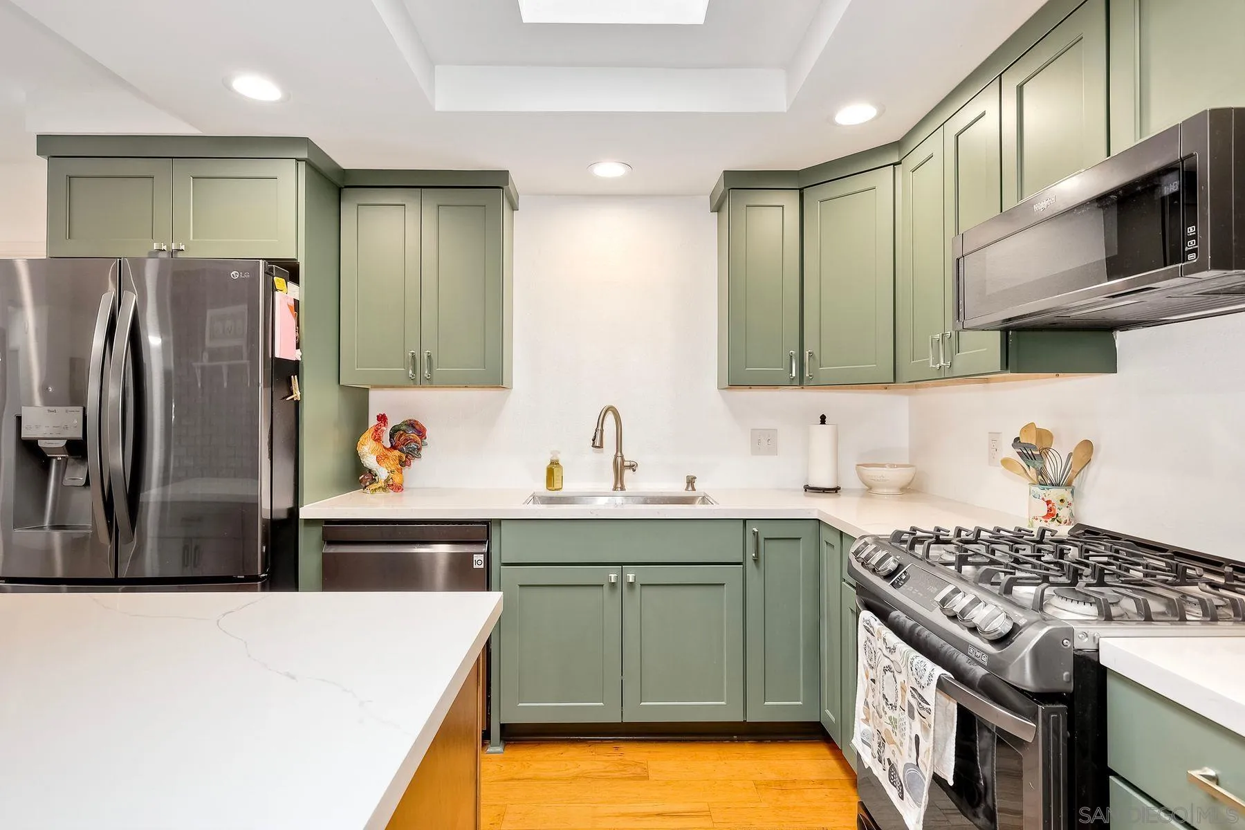 1915 Rockhoff Road Escondido, CA 92026 - Photo 16 of 43 a kitchen with a sink a stove and refrigerator