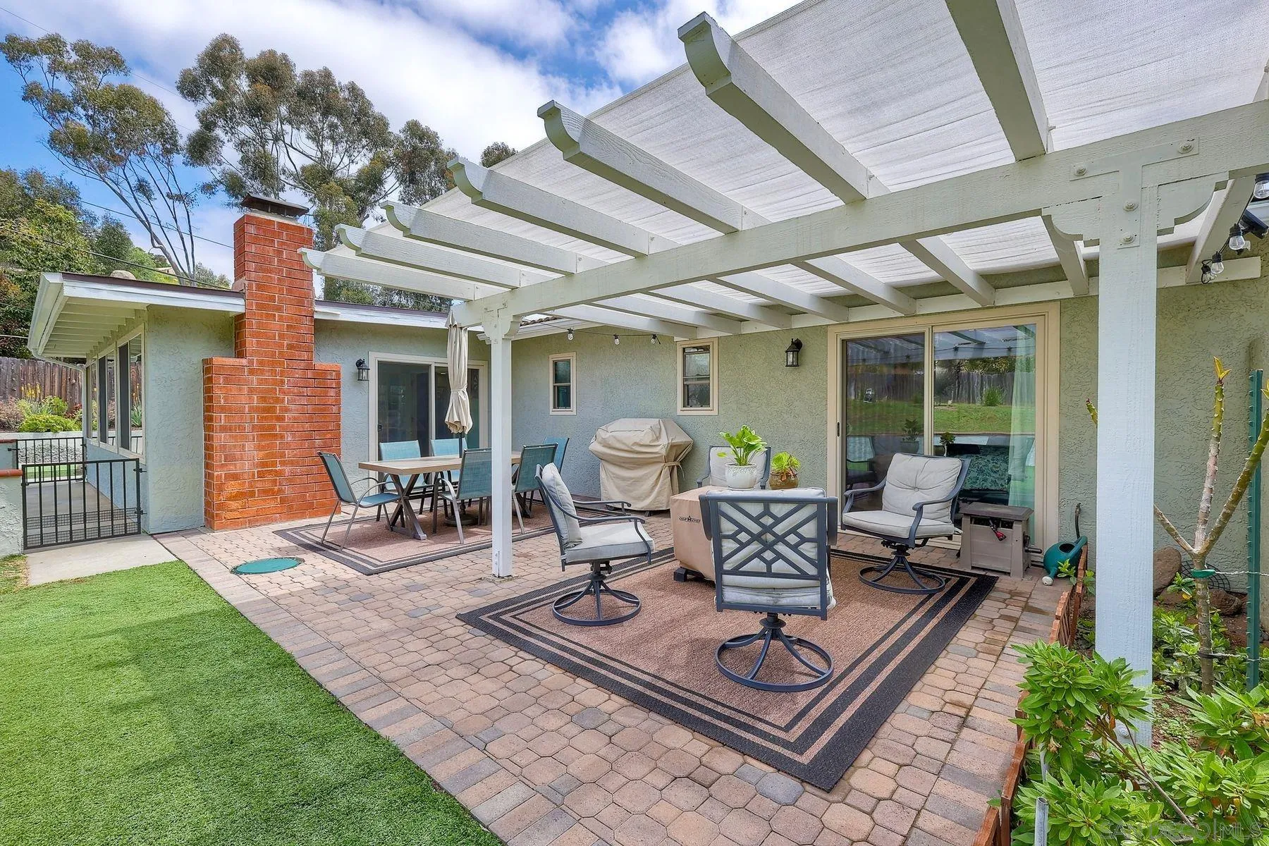 1915 Rockhoff Road Escondido, CA 92026 - Photo 27 of 43 a view of a patio with table and chairs and potted plants