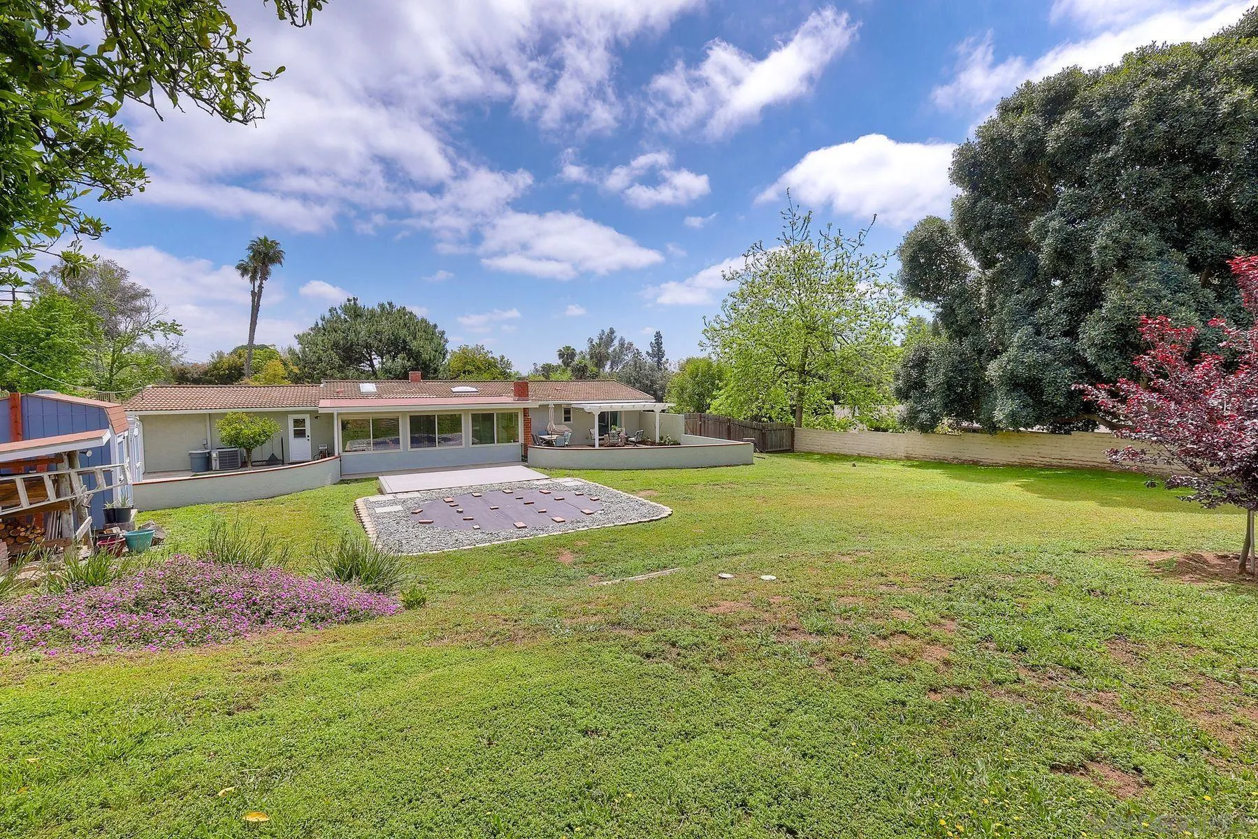 1915 Rockhoff Road Escondido, CA 92026 - Photo 30 of 43 a view of a house with a big yard