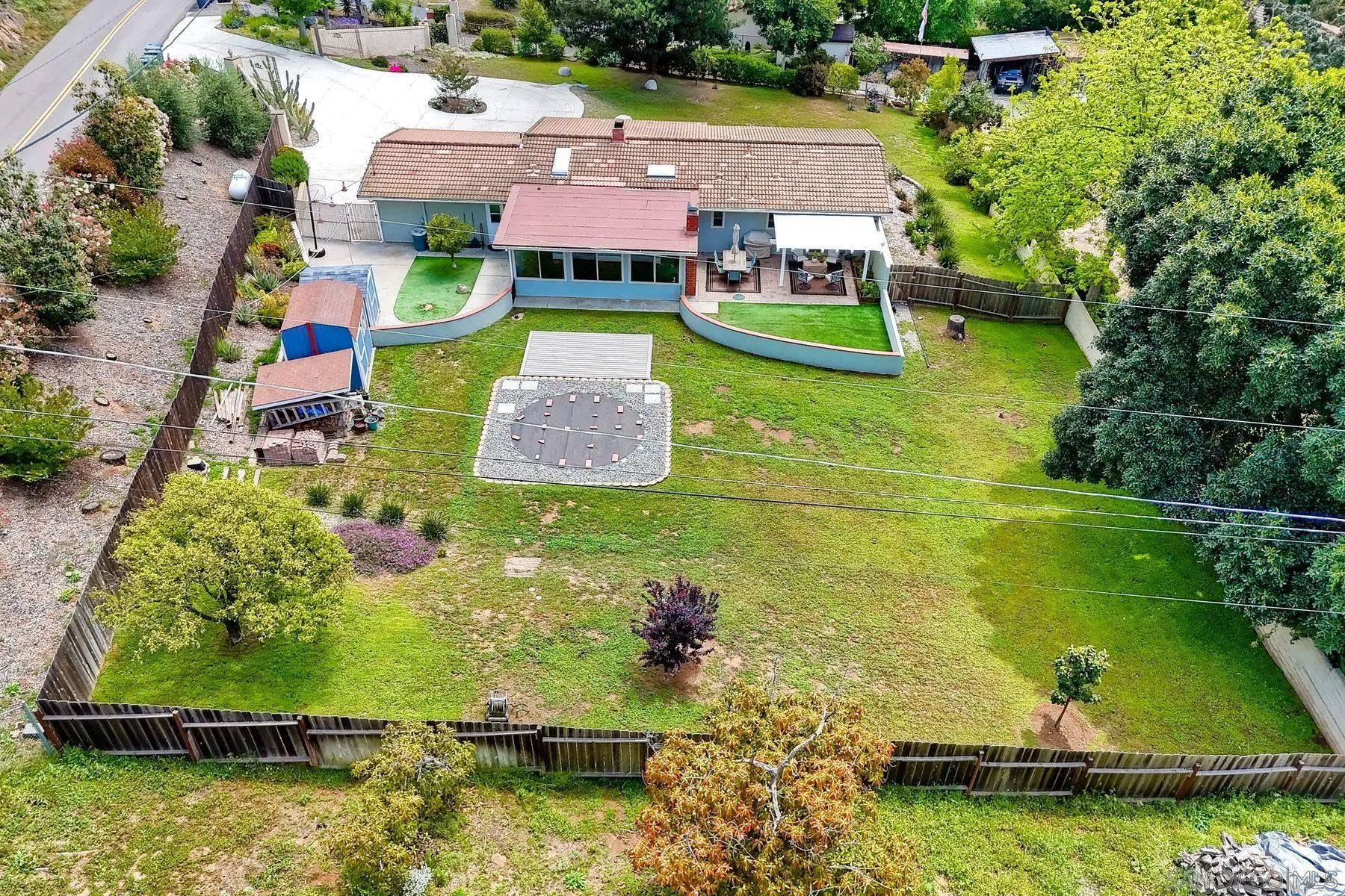 1915 Rockhoff Road Escondido, CA 92026 - Photo 39 of 43 an aerial view of a house with swimming pool a yard and lake view