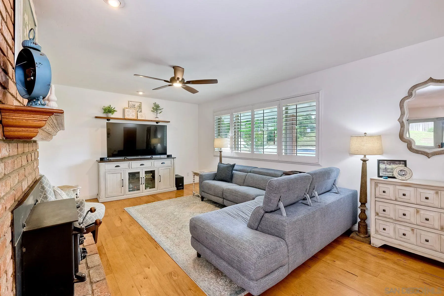 1915 Rockhoff Road Escondido, CA 92026 - Photo 6 of 43 a living room with furniture and a flat screen tv