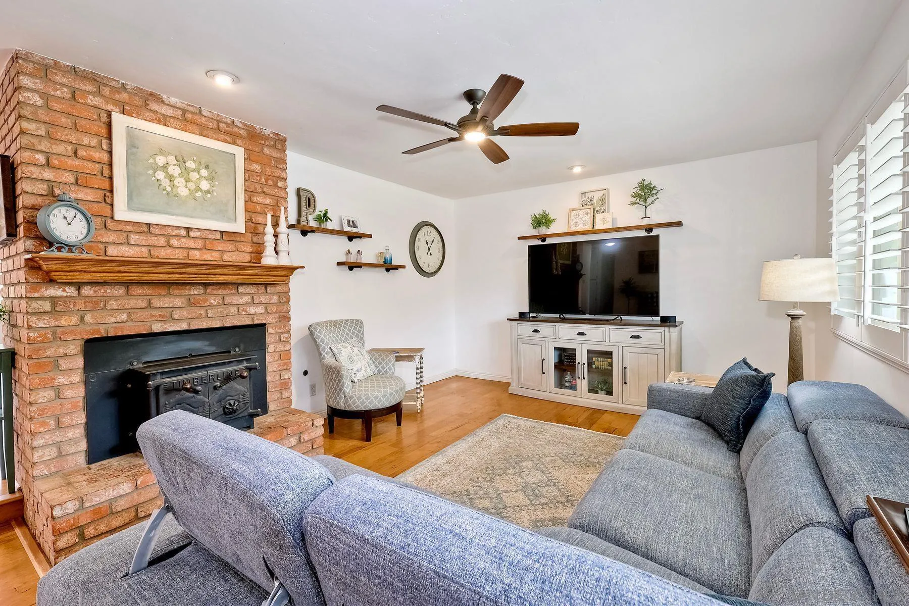 1915 Rockhoff Road Escondido, CA 92026 - Photo 7 of 43 a living room with furniture a fireplace and a flat screen tv