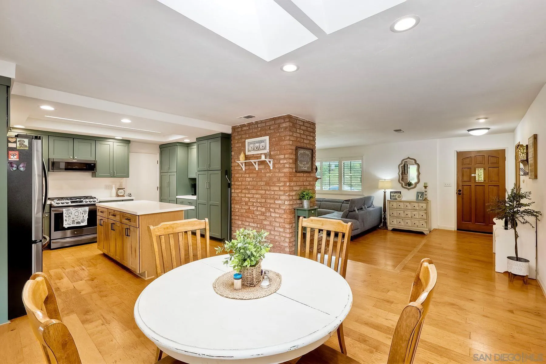 1915 Rockhoff Road Escondido, CA 92026 - Photo 10 of 43 a living room with fireplace furniture and a wooden floor