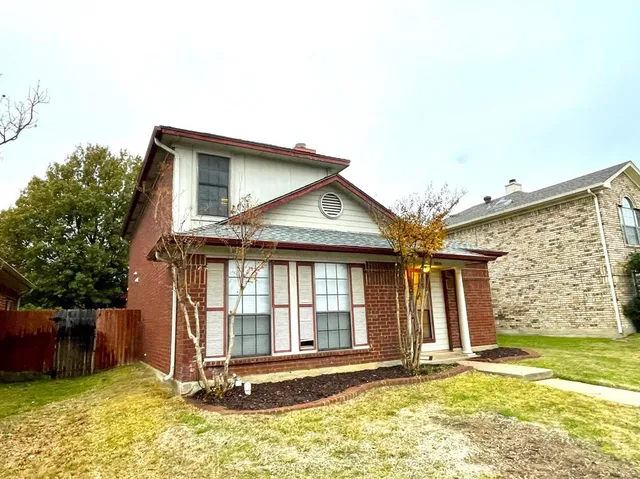 a view of a house with wooden floor and a yard
