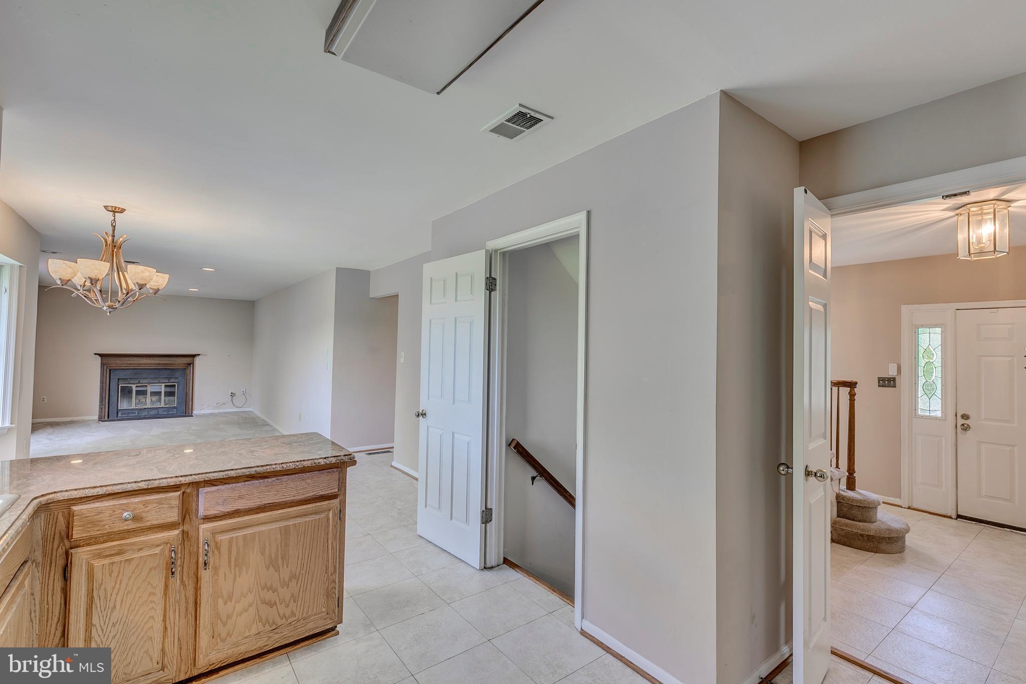10801 Golf Course Court Bowie, MD 20721 - Photo 13 of 52 a kitchen with a refrigerator and a sink