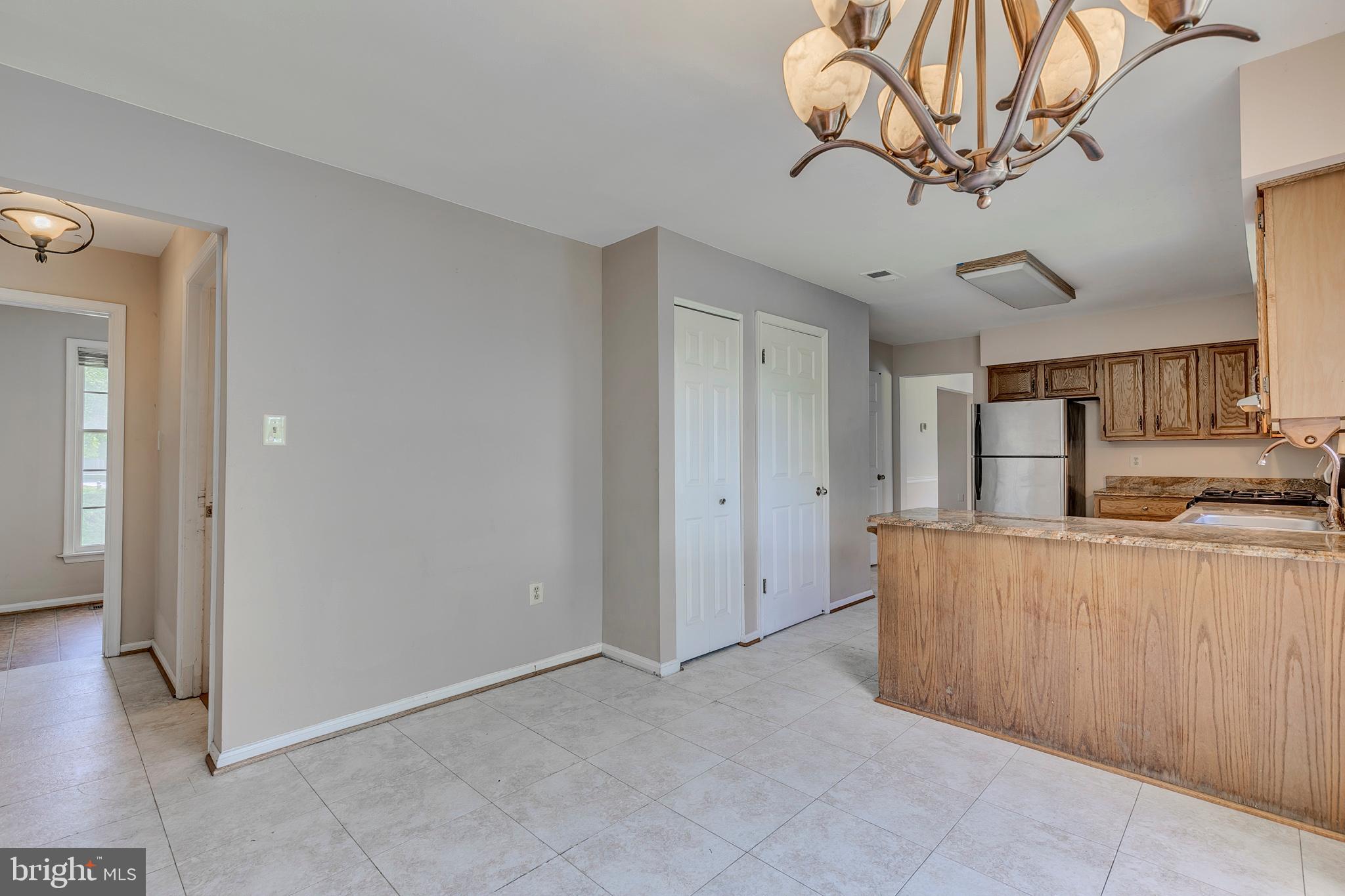 10801 Golf Course Court Bowie, MD 20721 - Photo 15 of 52 a view of kitchen with stainless steel appliances granite countertop living room