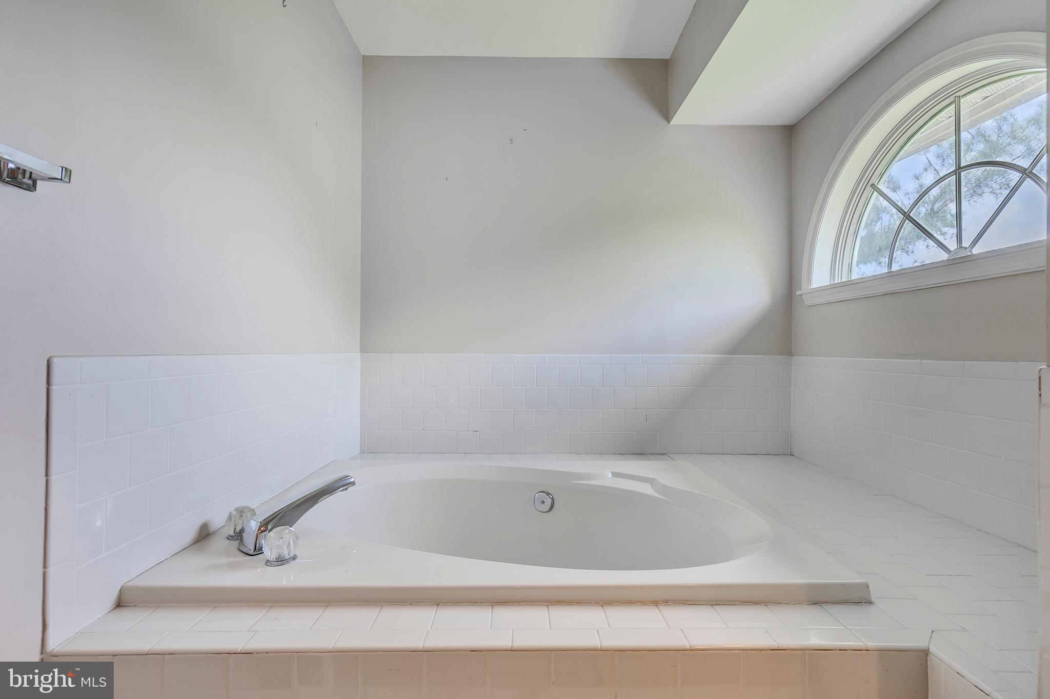 10801 Golf Course Court Bowie, MD 20721 - Photo 23 of 52 a bathroom with a bathtub