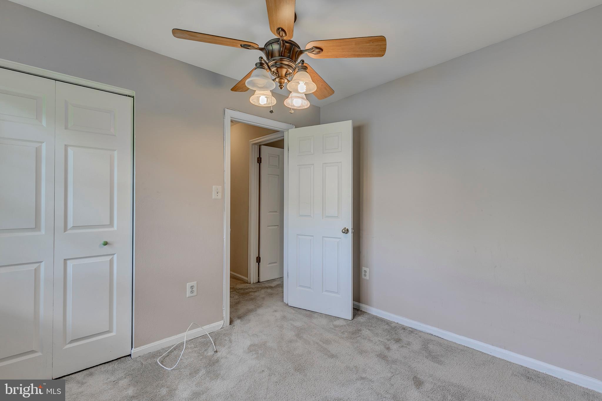 10801 Golf Course Court Bowie, MD 20721 - Photo 32 of 52 an empty room and chandelier fan