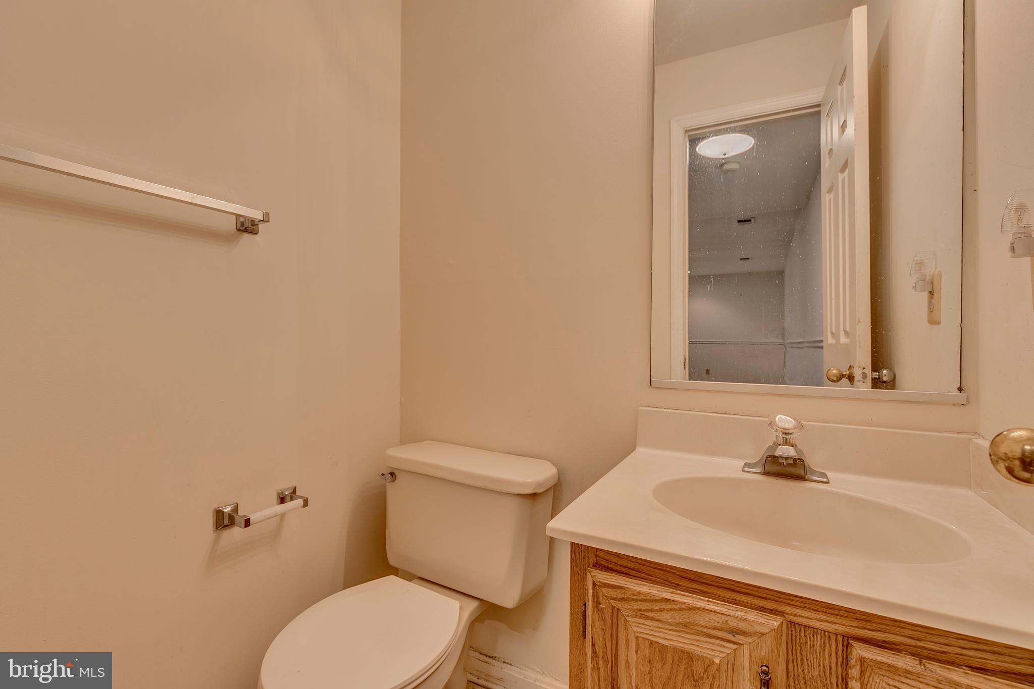 10801 Golf Course Court Bowie, MD 20721 - Photo 41 of 52 a bathroom with a sink and a toilet