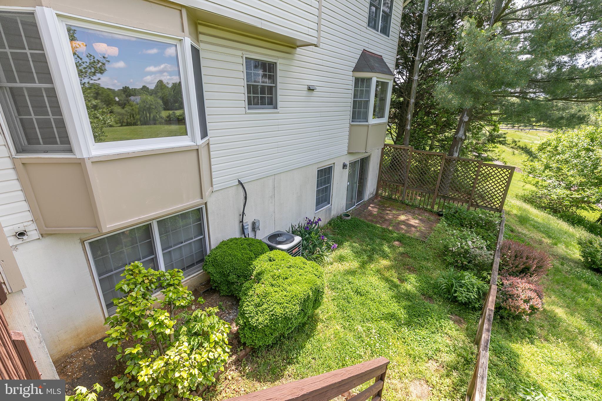 10801 Golf Course Court Bowie, MD 20721 - Photo 44 of 52 a backyard of a house with lots of green space
