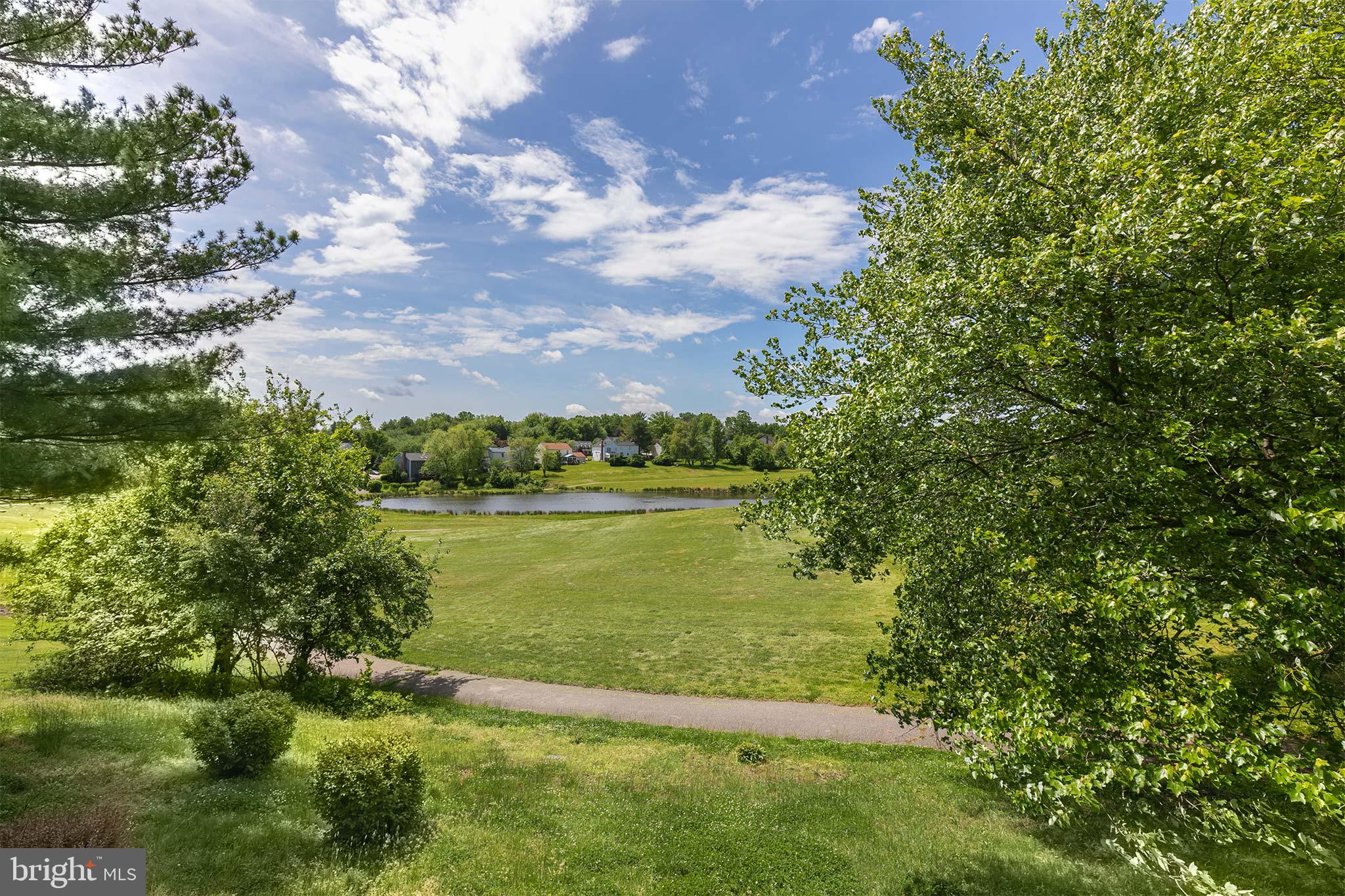 10801 Golf Course Court Bowie, MD 20721 - Photo 45 of 52 a view of a lake with a yard