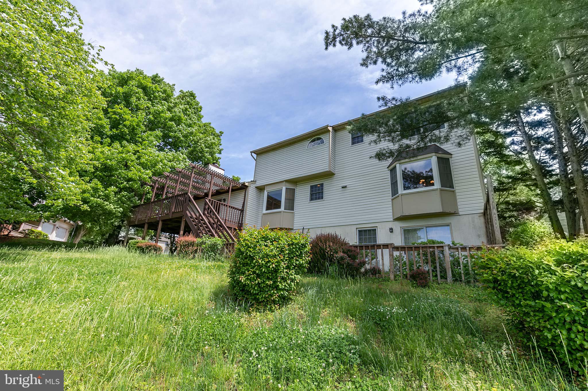 10801 Golf Course Court Bowie, MD 20721 - Photo 47 of 52 a front view of a house with a yard