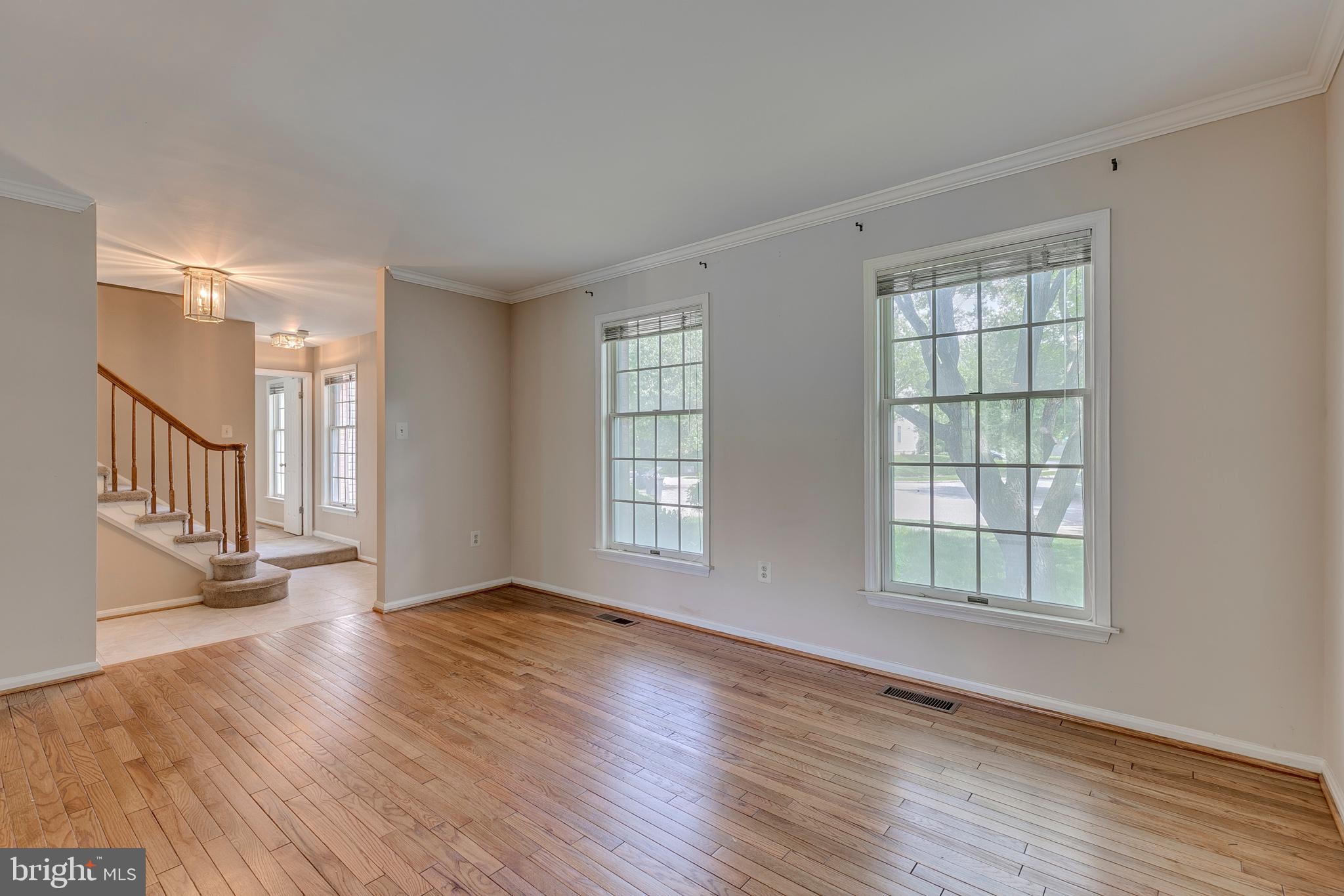 10801 Golf Course Court Bowie, MD 20721 - Photo 8 of 52 a view of an empty room with wooden floor and a window